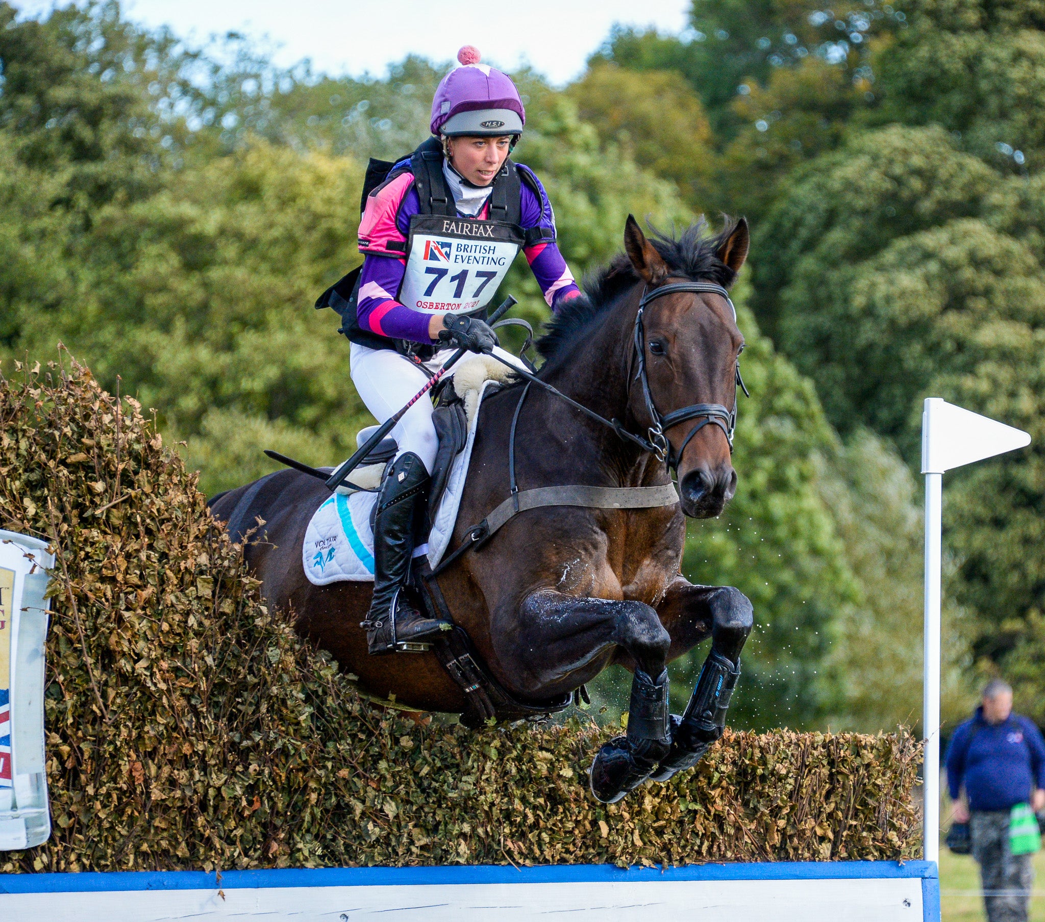 Ginny Howe, event rider, jumping a brush fence